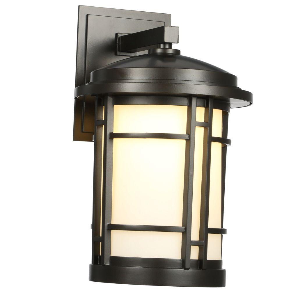 World Import 9 in.Burnished Bronze Outdoor LED Wall Sconce with White Opal Glass